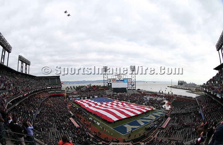 122912 Kraft SA-012.JPG - Dec 29, 2012; San Francisco, CA, USA; A Navy fighter jet flyover durig the national anthem before the 2012 Kraft Fighting Hunger Bowl at AT&T Park.